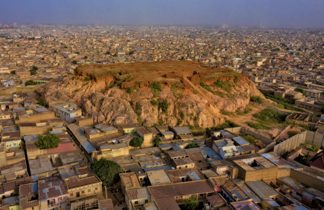 Kano cityscape surrounding a central rocky hill